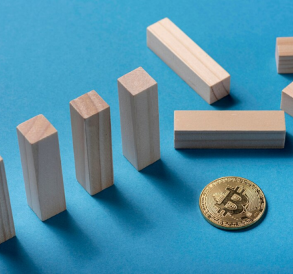 Wooden blocks and a crypto coin